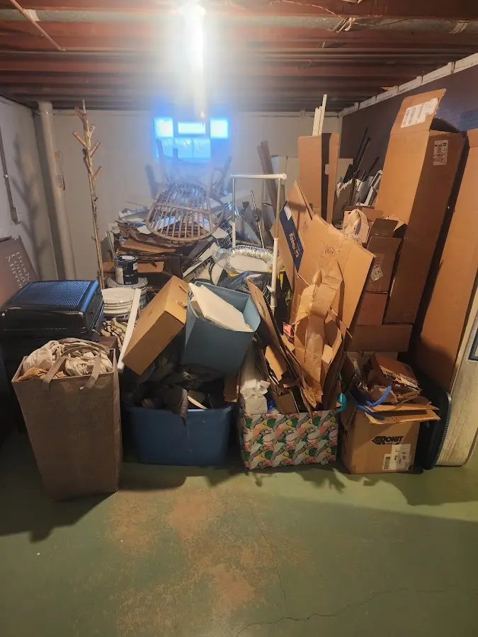 Roll-off dumpster container at job site for 2 Yard Dumpster Rental in Madison Heights